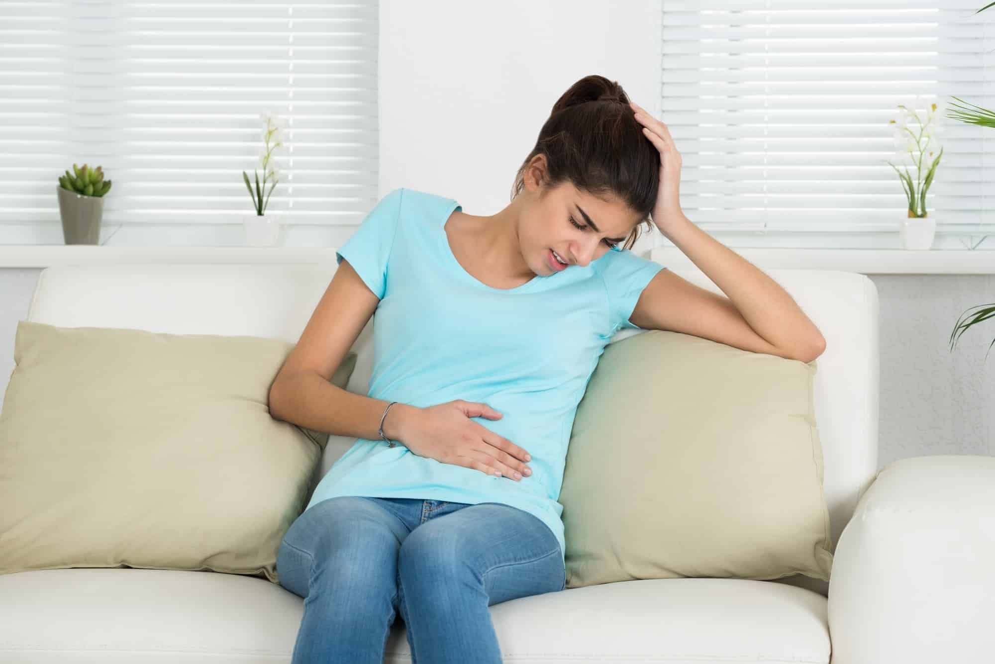 young woman with pain from IUD