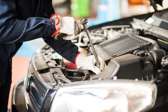 car mechanic working on car