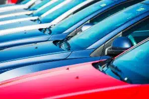 Closeup of a row of cars on a lot - reynolds