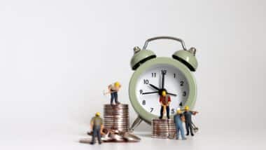 alarm clock and money representation of labor