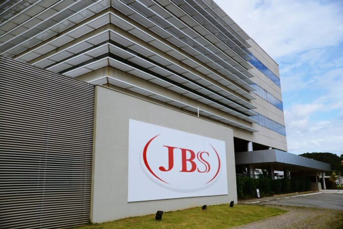 A sign outside a JBS office building - Pork prices - indirect purchaser, pork class action settlement