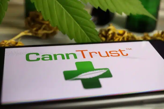 canntrust logo on a smartphone - canntrust class action
