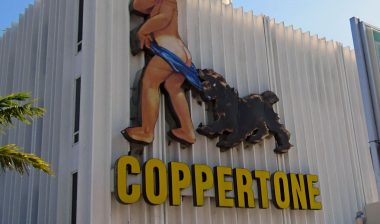 A vintage Coppertone sign, salvaged from a hurricane-damaged building elsewhere in Miami