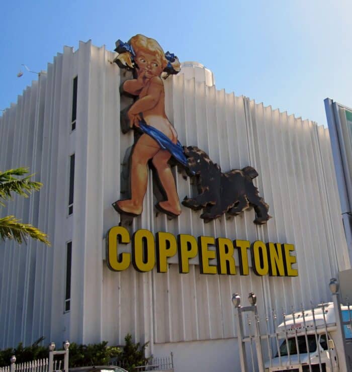 A vintage Coppertone sign, salvaged from a hurricane-damaged building elsewhere in Miami