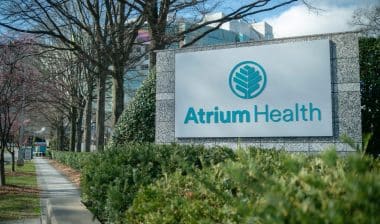 Atrium Health Carolinas Medical Center sign and logo, surgical mesh, settlement