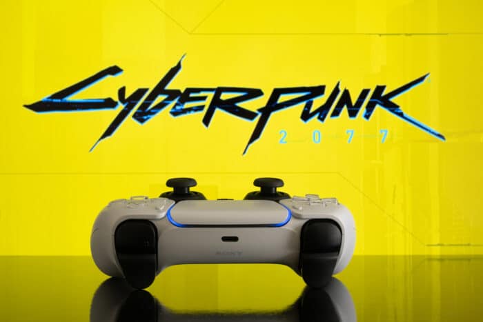 Playstation 5 controller with Cyberpunk 2077 logo on screen,