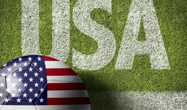 U.S. flag Soccer ball on Soccer field with the text: USA ; U.S. Soccer, women's soccer, gender discrimination, wage discrimination, lawsuit