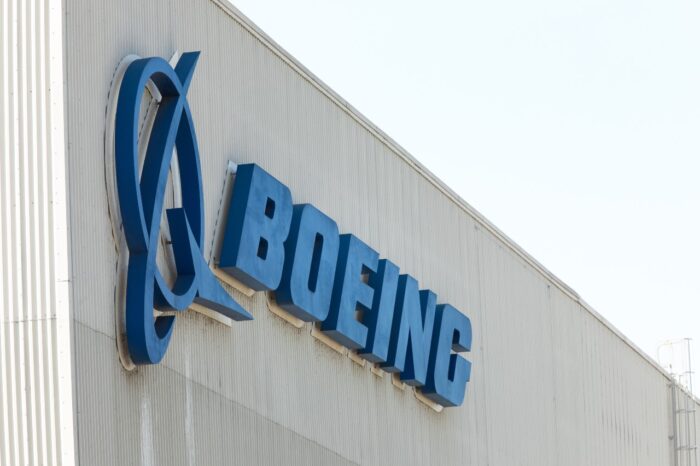 "Boeing" sign on the exterior of the 737 MAX airliner factory in Renton,