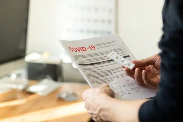 COVID-19 Rapid test cassette for coronavirus. Man holding a rapid testing kits. Coronavirus antibody test. - antibody blood tests