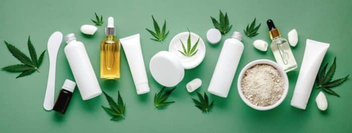 Set of hemp skin care cosmetics in white mockup packaging.
