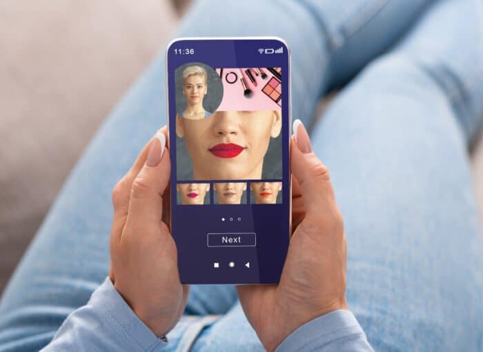 Woman Trying Different Lipstick Color Online On Smartphone,
