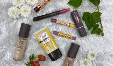 a variety of Burt’s Bees products on white background.