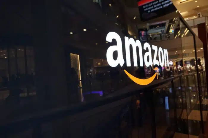 Amazon logo on black shiny wall in mall