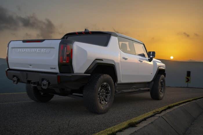 GMC HUMMER EV PICKUP on the road.3D Illustration.