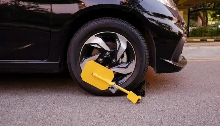 Boot on a car wheel - castle parking solutions - georgia class action