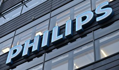 A neon sign for the Dutch electronics manufacturer Philips corporation on the wall of an office building in the Kista business district in Stockholm, Sweden.