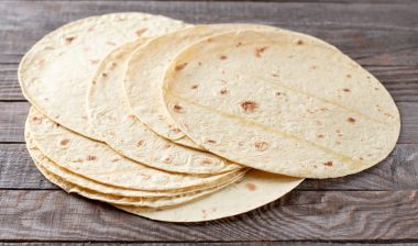 Mexican corn tortillas for sentencing tacos, quesadilla, fajitos, tortilla on a wooden table