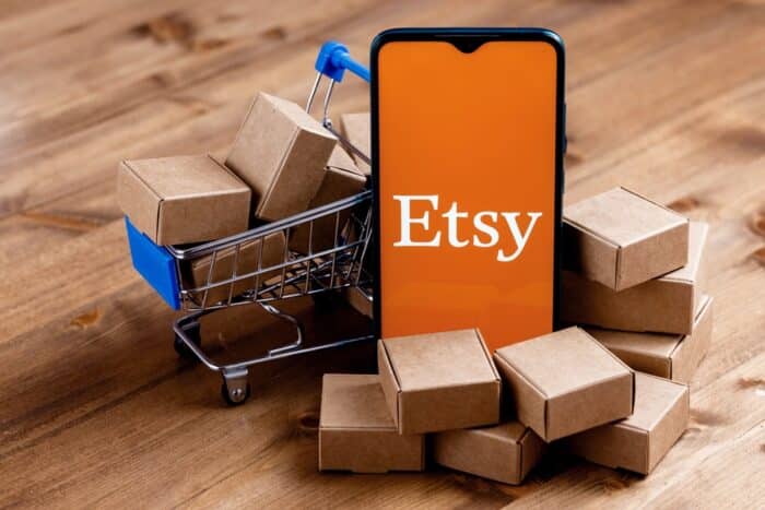 Photo of Etsy logo displayed on a smartphone screen.