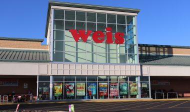 Photo of exterior Weis supermarket building .