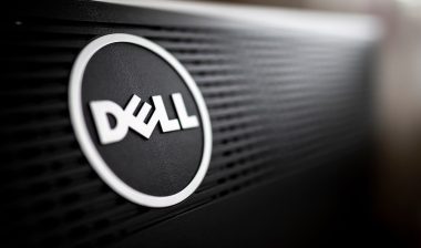 Close-up of Dell company logo on the back of a professional black monitor in natural light.