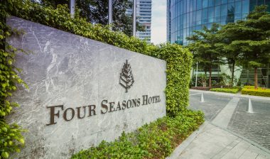 Photo of Four Seasons Hotel exterior sign.