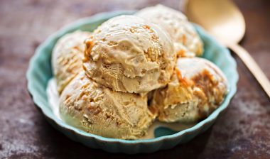 Salted caramel ice creams on blue plate.