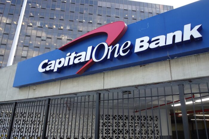 A Capital One Bank sign on the parking garage for the Rego Park Office Tower in Queens - zelle, fraud, class action