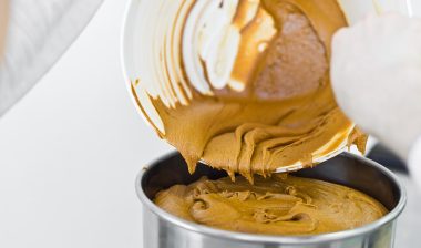 Production working making peanut butter.