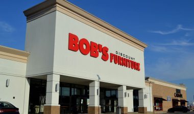 Exterior of a Bob's Discount Store against a blue sky.