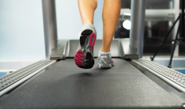 Image of female foot running on treadmill.