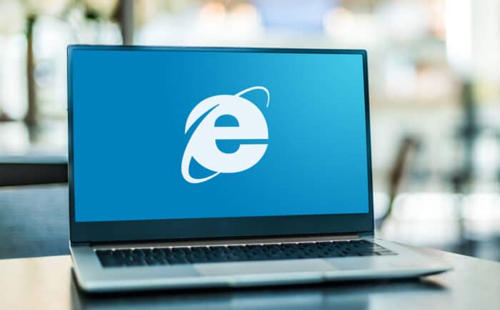 Laptop computer displaying logo of Internet Explorer, a web browser developed by Microsoft.