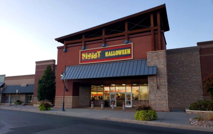 Exterior of Spirit Halloween store in Loveland, Colorado against a blue sky - black light recall