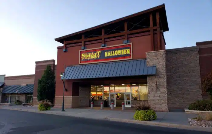 Exterior of Spirit Halloween store in Loveland, Colorado against a blue sky - black light recall
