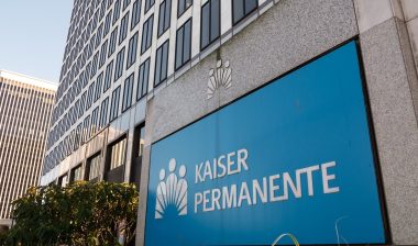 Kaiser Permanente medical office building front entrance exterior facade and sign in downtown Portland Lloyd Center.
