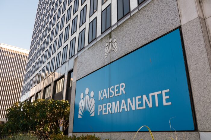 Kaiser Permanente medical office building front entrance exterior facade and sign in downtown Portland Lloyd Center.