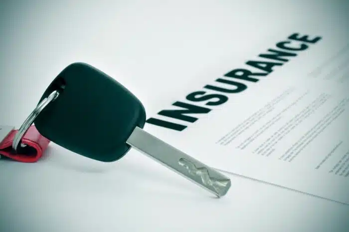 closeup of a car key and a insurance policy on a white surface, Red Rocks Credit Union gap insurance