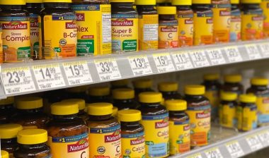 A selection of Nature Made vitamins at a Walgreens pharmacy.