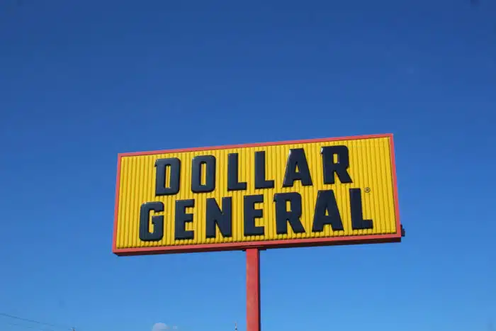 Dollar General sign against a blue sky - class action - lidocaine patch