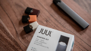 A JUUL Starter Kit on a table.