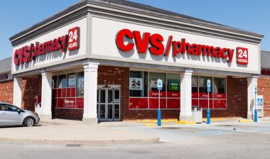 Exterior of a CVS store against a blue sky.