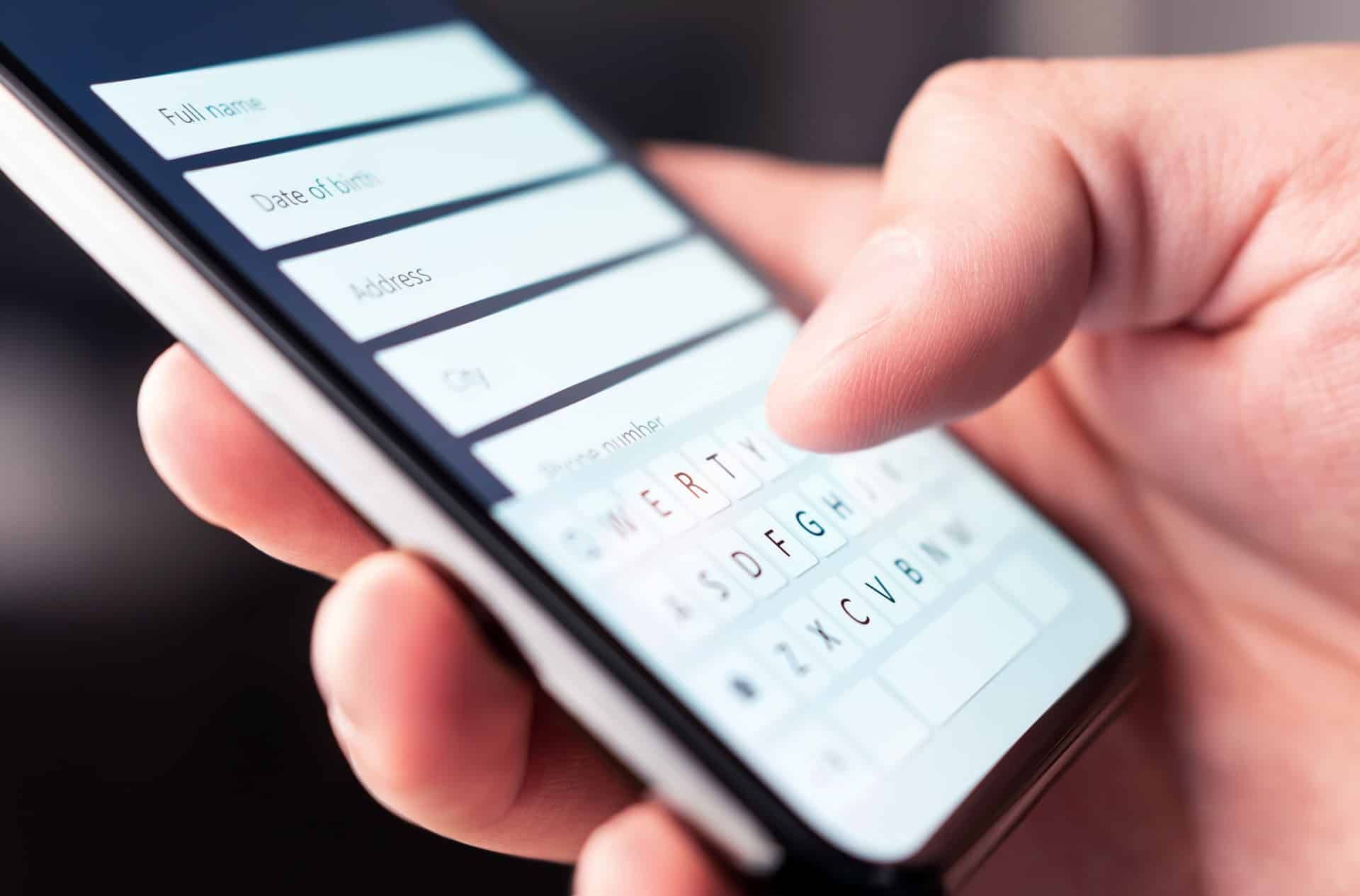 Closeup of a person filling out a form on their smartphone - settlements closing soon