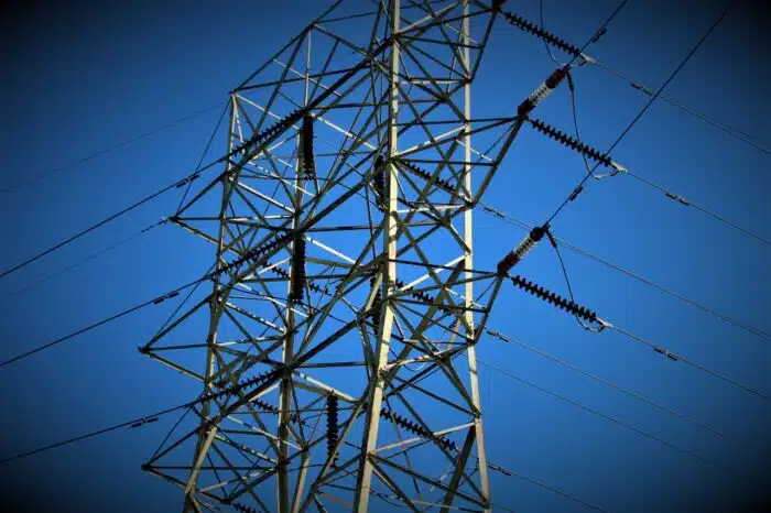 An electrical tower against a blue sky - First Energy settlement, ohio edison lawsuit