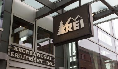 The REI sign at the entrance of its store in Portland.