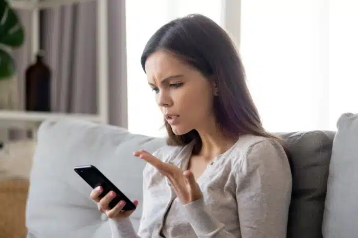 Upset young woman getting unwanted spam calls - NoTax4Nash, class action