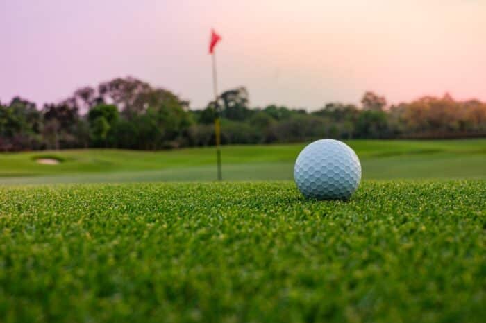 A long putt on the green as sunset closes in; Fairways at Lake Ridge