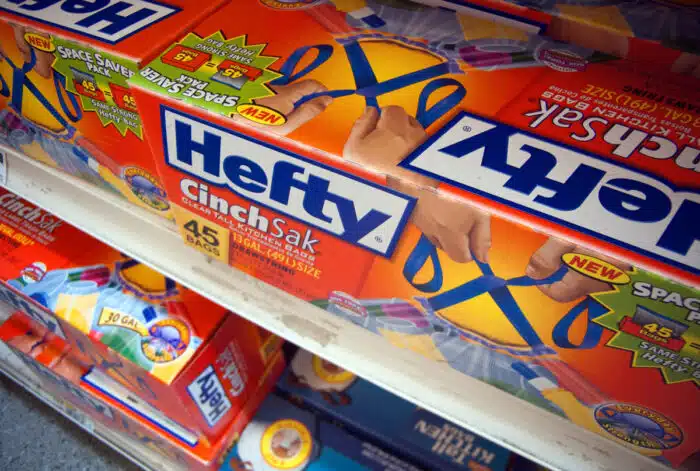 Boxes of Reynolds Hefty trash bags are seen on a supermarket shelf.