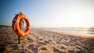 Life Buoy on beach post at sunset