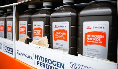 A view of several bottles of Swan hydrogen peroxide topical solution USP on display at a local big box grocery store.