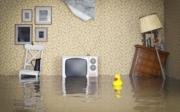 Water rises in a flooded home interior - Erie Insurance Co. settlement, class action lawsuit, nonmaterial depreciation