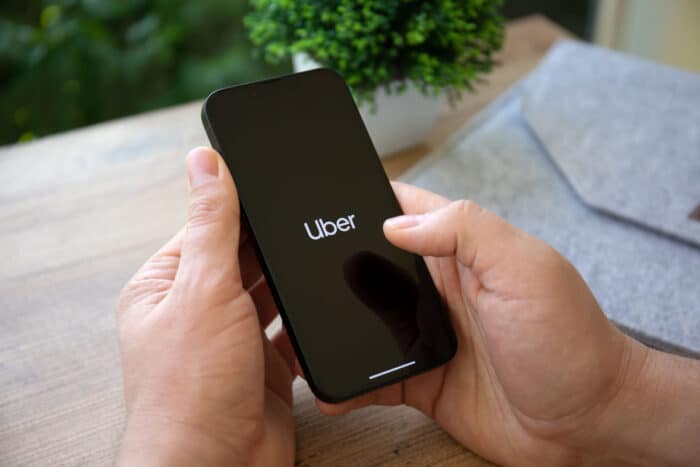 Close up of Uber logo on smartphone screen.